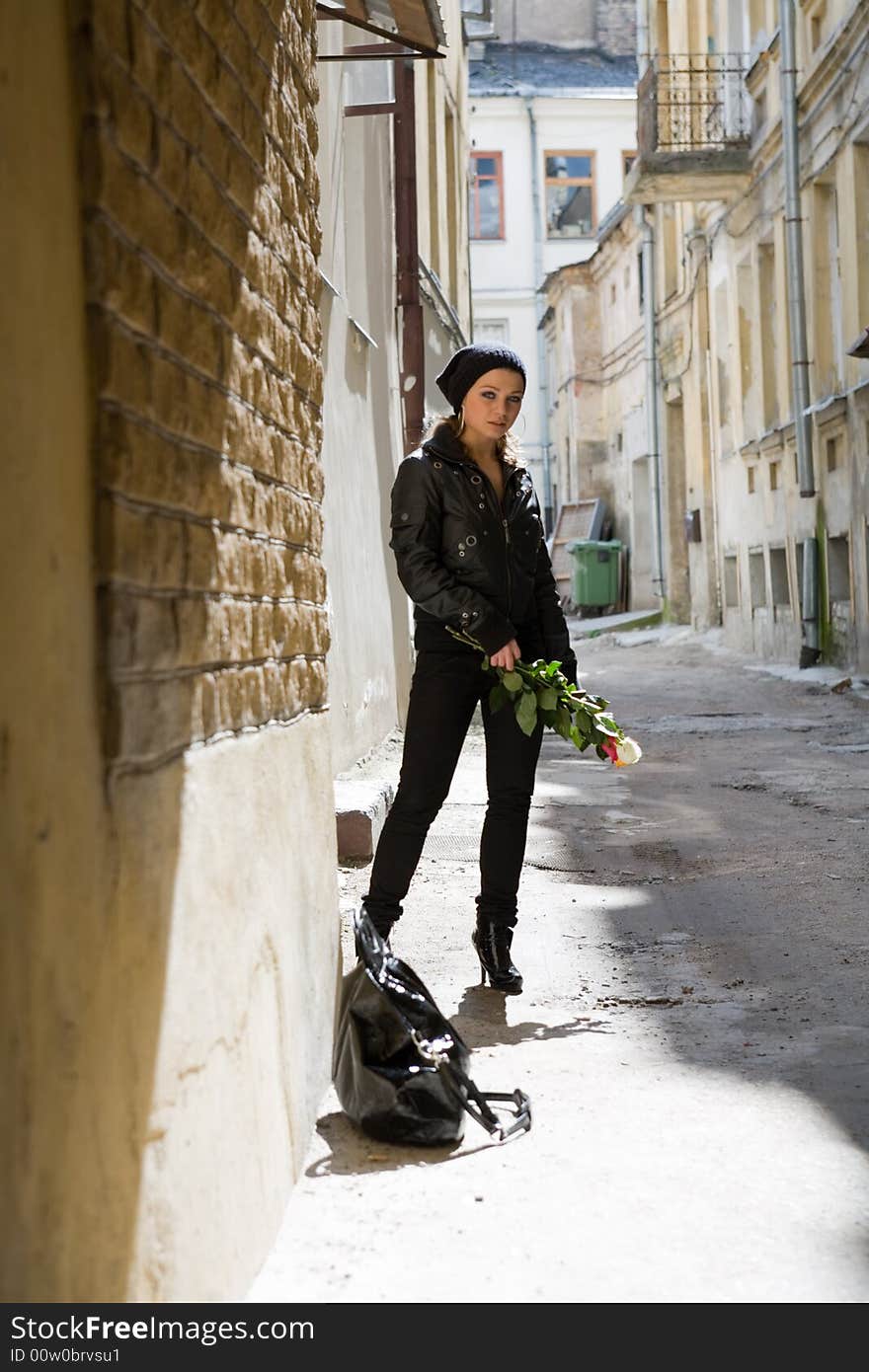 Portrait of the girl in a court yard