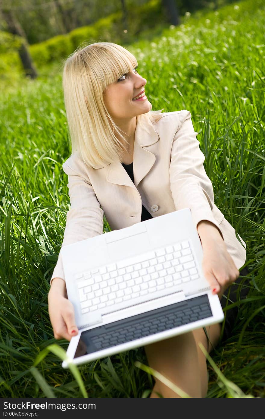 Young pretty businesswoman with laptop. Young pretty businesswoman with laptop