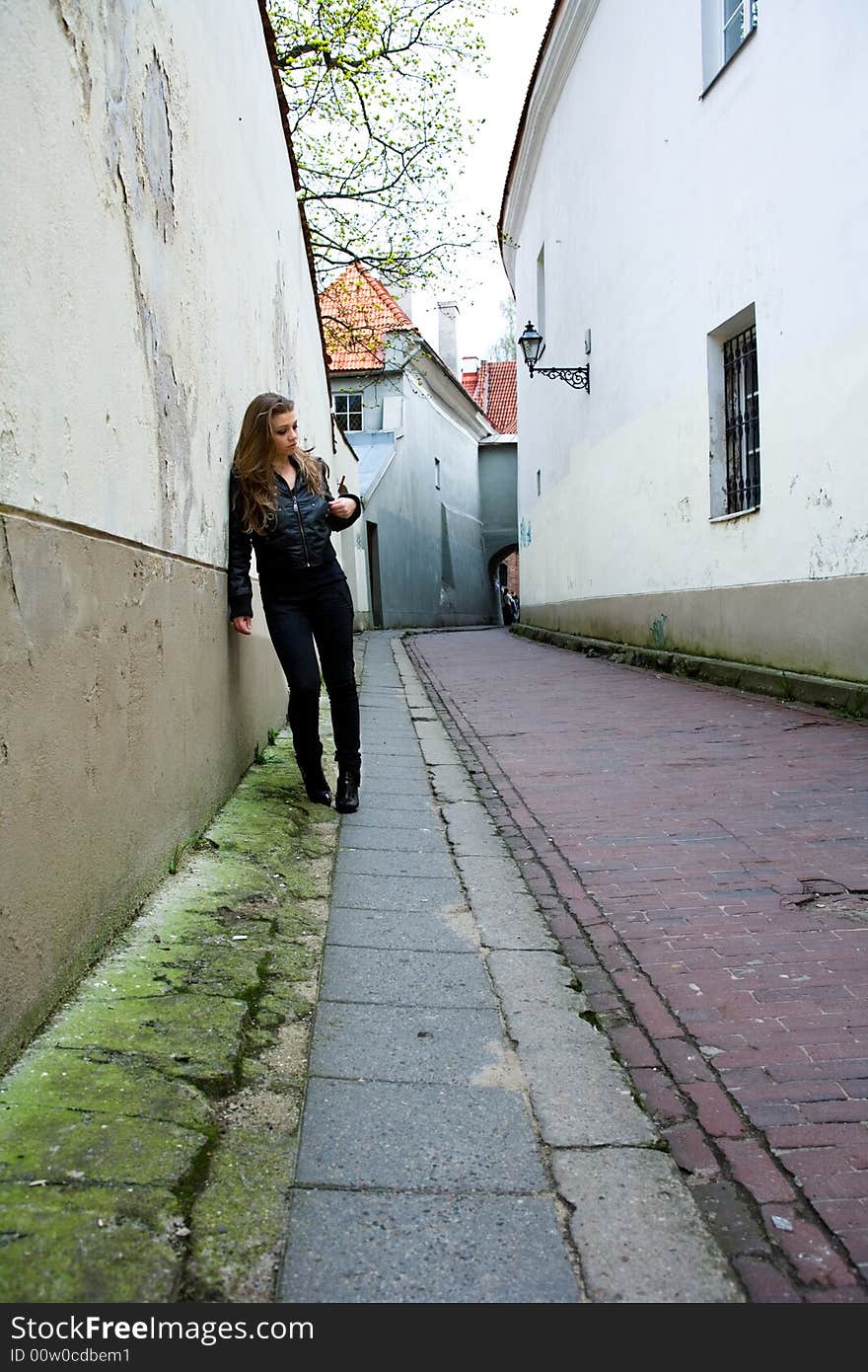 Portrait of the girl near wall