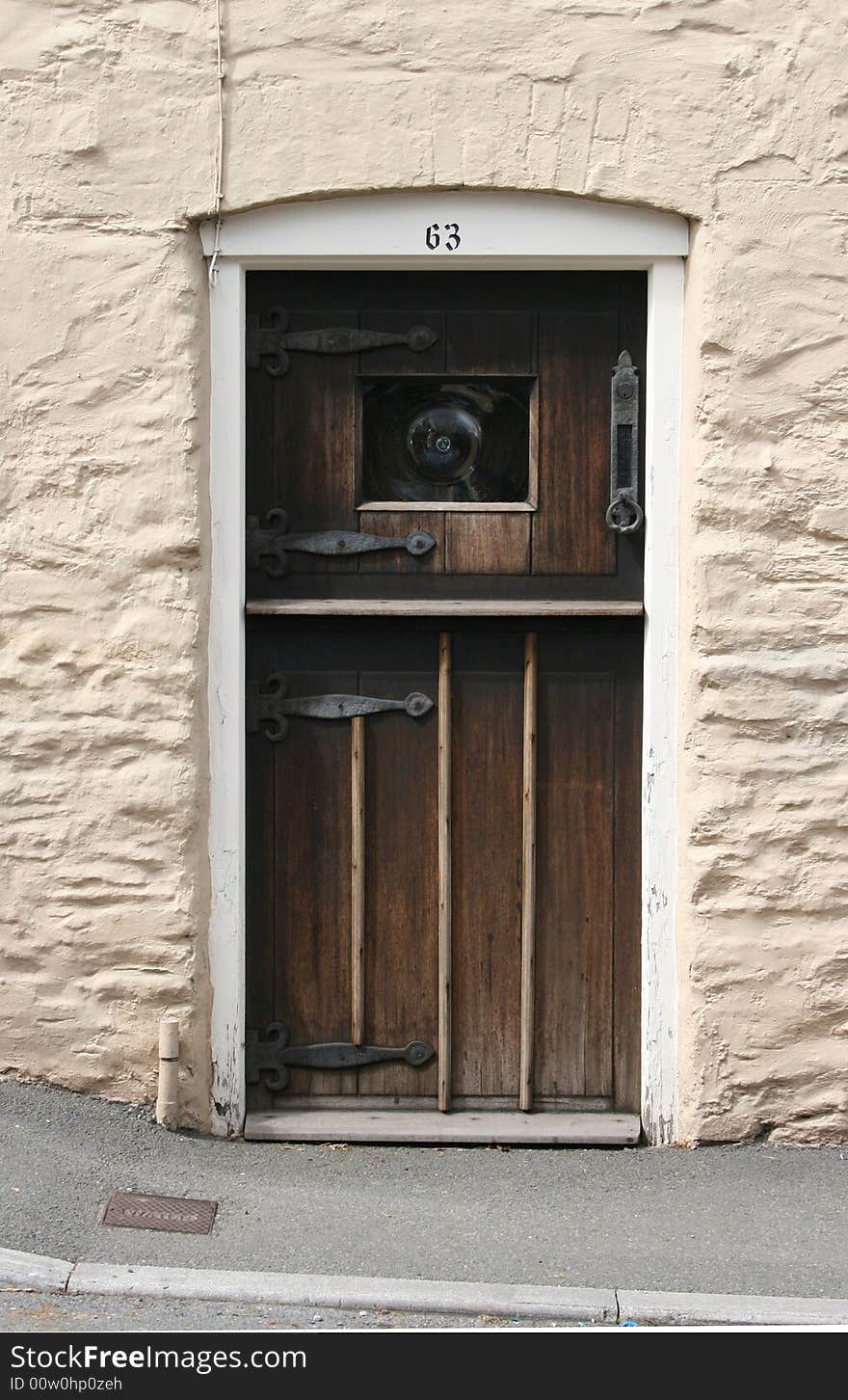 An old wooden cottage door. An old wooden cottage door