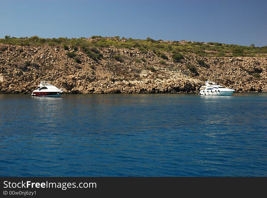 Boats on Mediterranean sea at Cape Greko, sunny day of Cyprus.