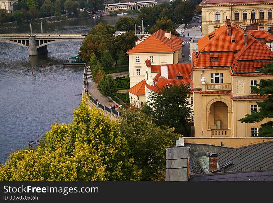 A city river bank with historical buildings