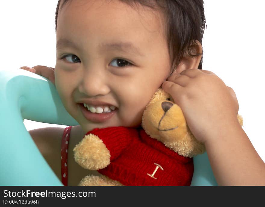 Girl with teddy bear on a white background