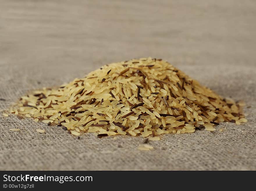 Wild rice grains, close-up, on a textile background