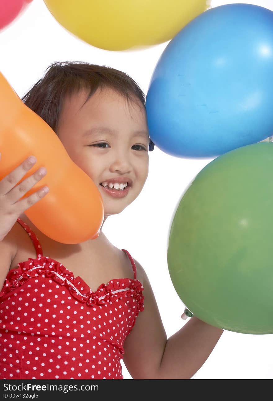 Young little toddler with the colorful balloons