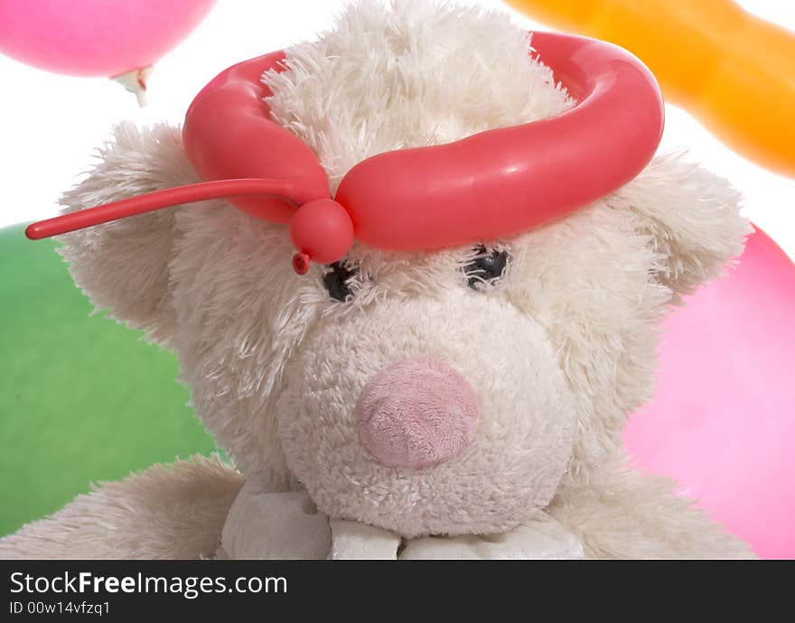 Teddy bear with balloon on a white background