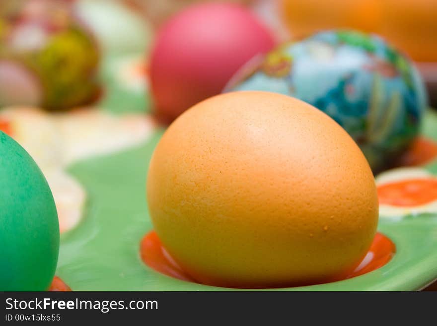 Colored easter eggs on the plate