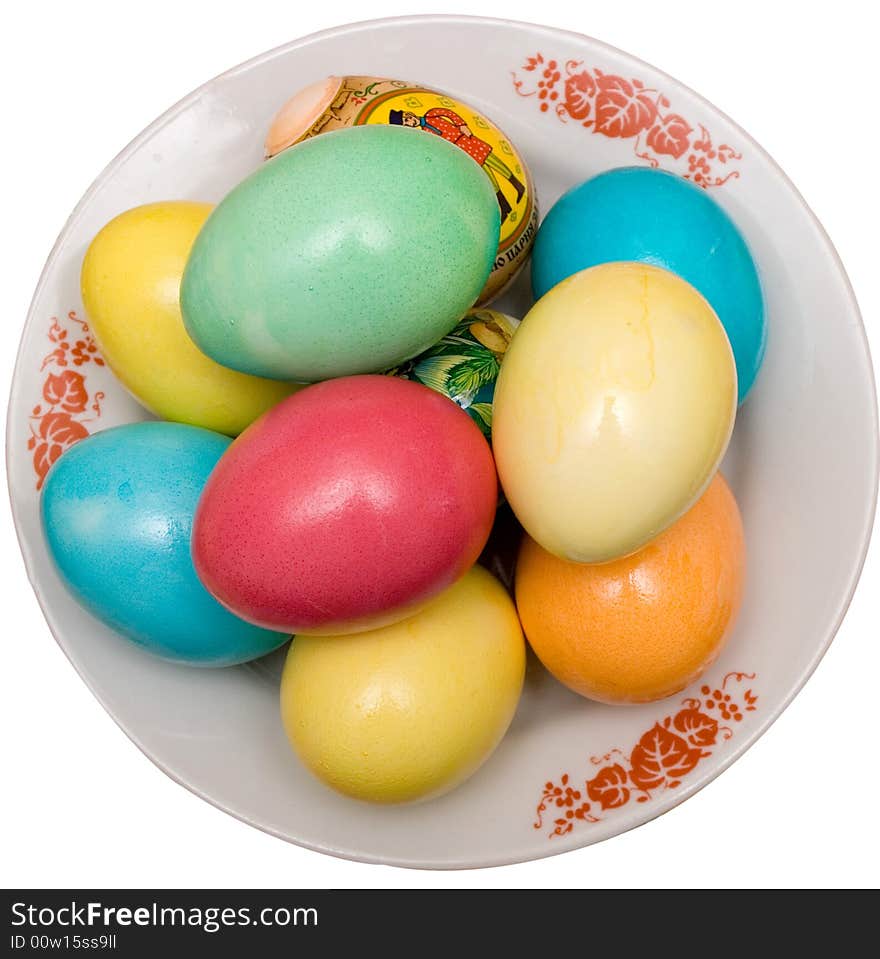 Colored easter eggs on the plate white isolated