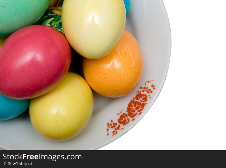 Colored easter eggs on the plate white isolated