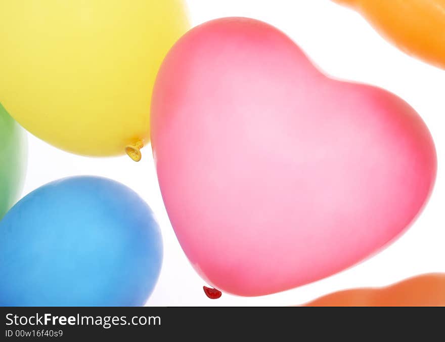 Many colorful balloons on a white background