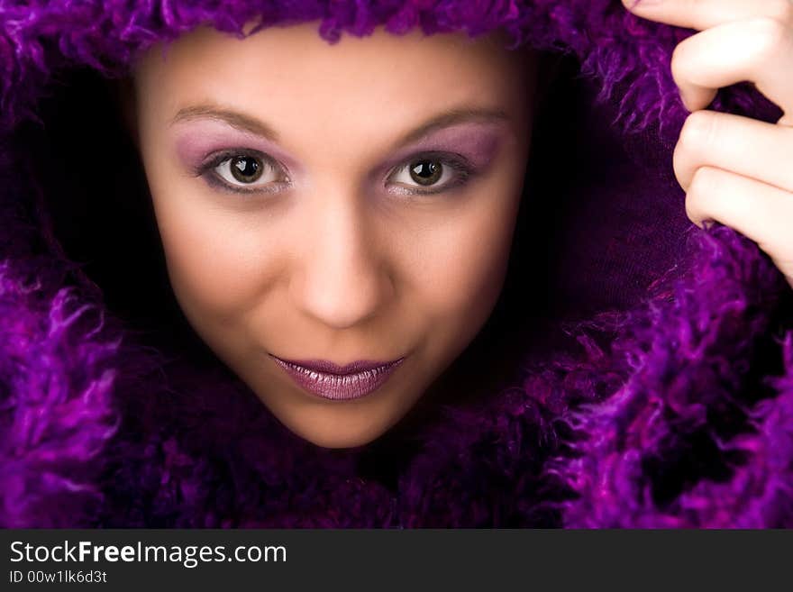 Beautiful young good looking woman with a purple sweater. Beautiful young good looking woman with a purple sweater