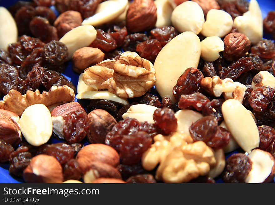 A mix of nuts and raisins. A mix of nuts and raisins