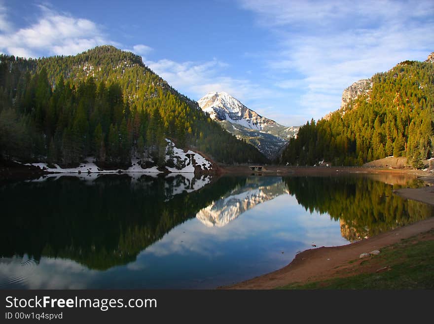 High Mountain lake in the spring showing reflections. High Mountain lake in the spring showing reflections