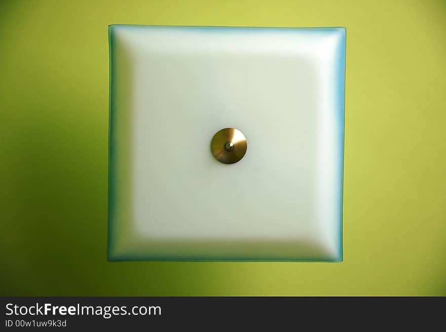 Photo of white lamp in green room. Photo of white lamp in green room