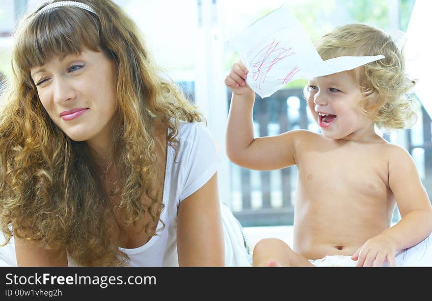 High key portrait of happy mother with baby. High key portrait of happy mother with baby