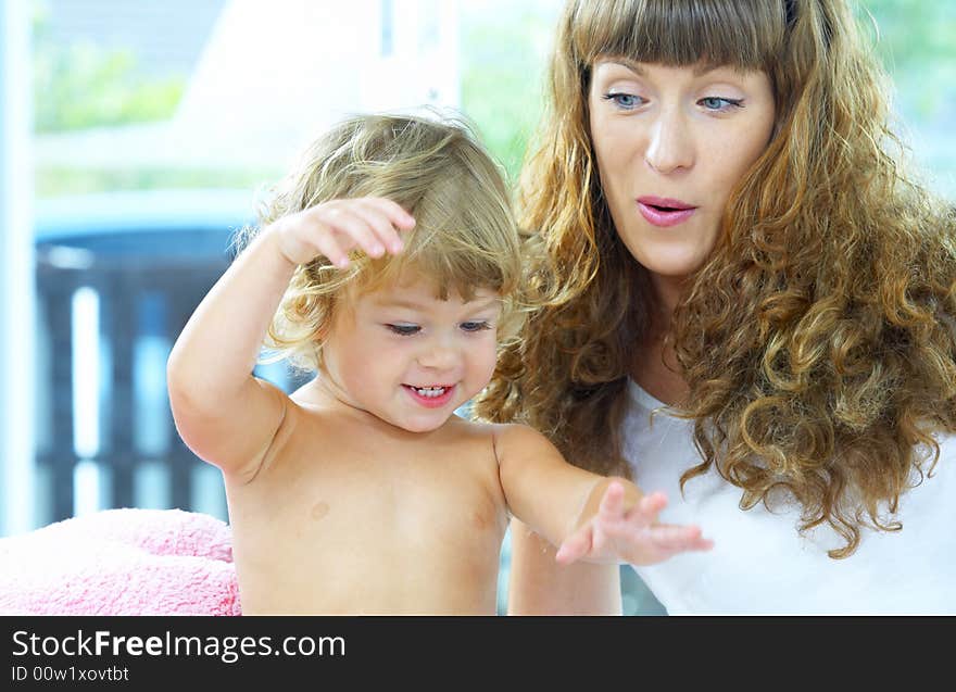 High key portrait of happy mother with baby. High key portrait of happy mother with baby