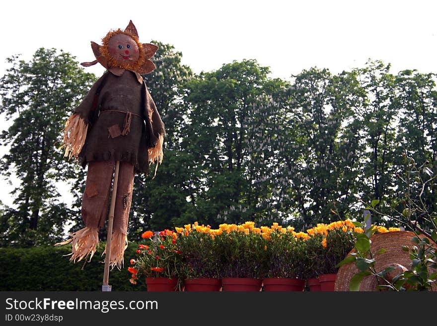 Smiling Scarecrow straw in an Italian garden