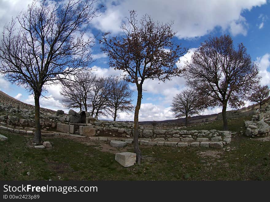 Tree and ruins in rural lanscape in Italy under blue cloudly sky. Tree and ruins in rural lanscape in Italy under blue cloudly sky