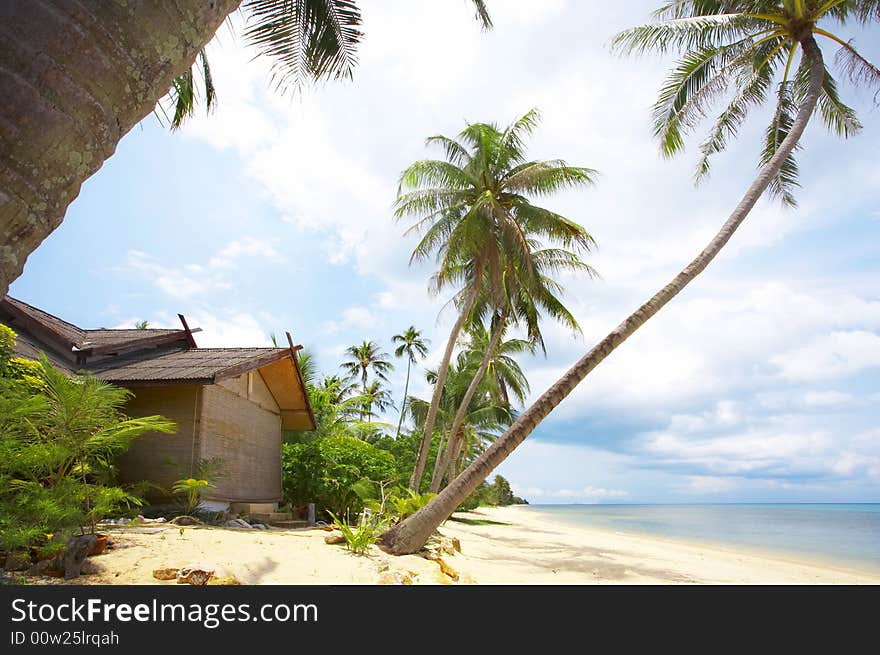 View of nice exotic hut on tropical beach. View of nice exotic hut on tropical beach