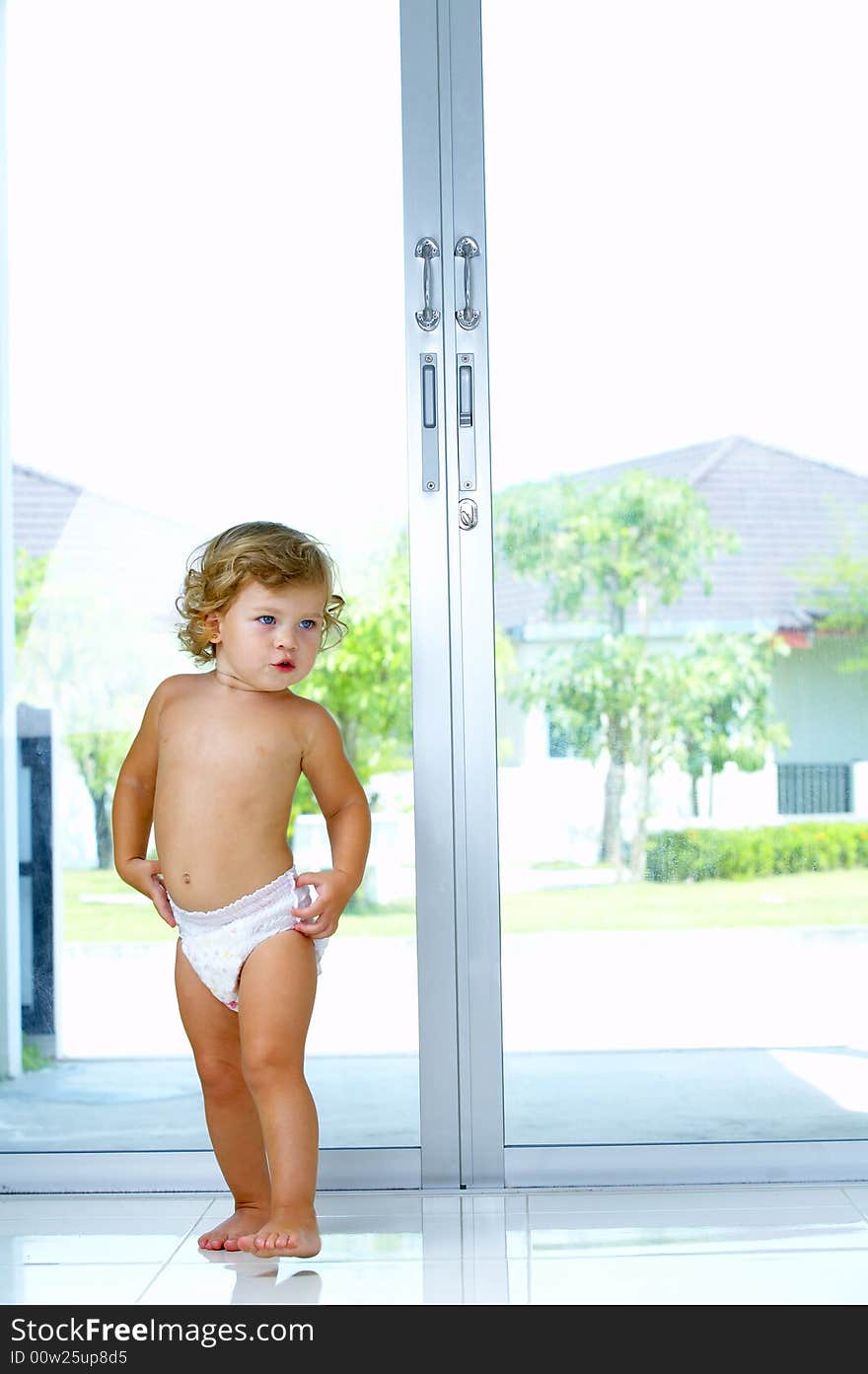 High key  indoor portrait of nice blond blue eyed baby. High key  indoor portrait of nice blond blue eyed baby