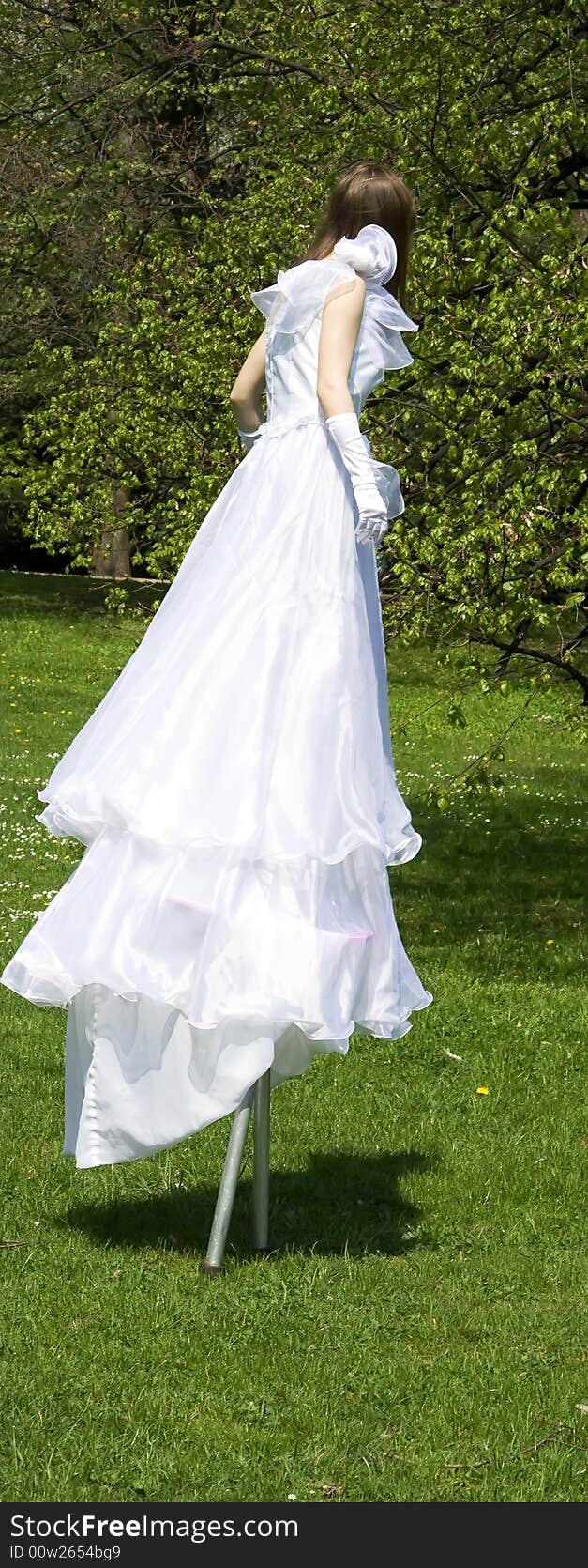 White woman on stilt