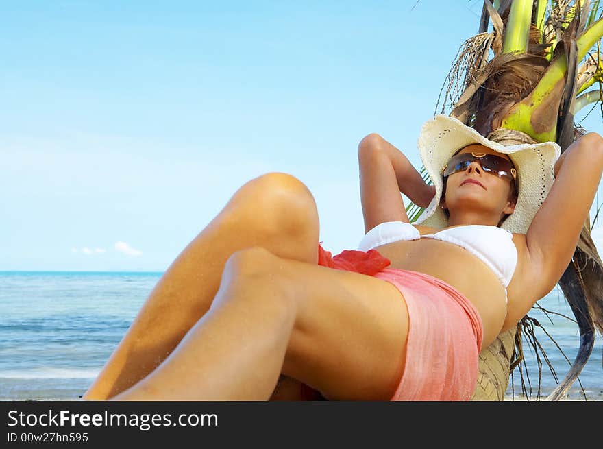 View of nice woman having fun on tropical beach. View of nice woman having fun on tropical beach