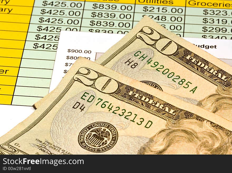 Close up of two american twenty dollar bills along with chart showing budget. Close up of two american twenty dollar bills along with chart showing budget