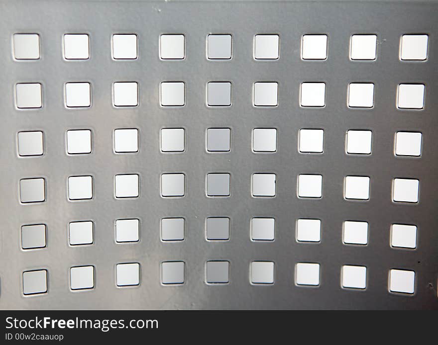 Metal with square holes. Modern background. Metal with square holes. Modern background.