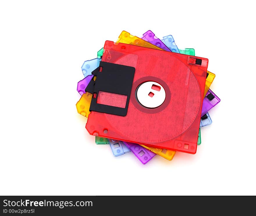 Pile of colorful floppy disks over a white surface