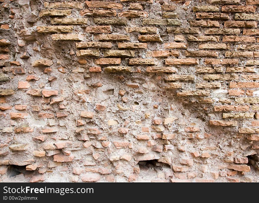 Ancient brick wall, partially crumbling