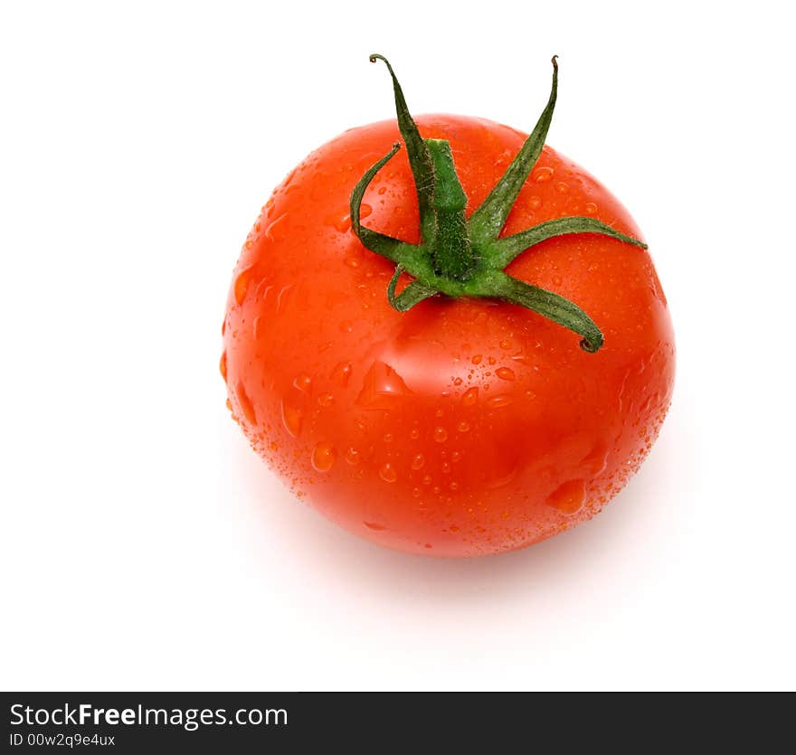 Fresh and juicy tomato with water drops on it