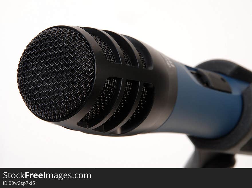 Black microphone grid close-up  over white