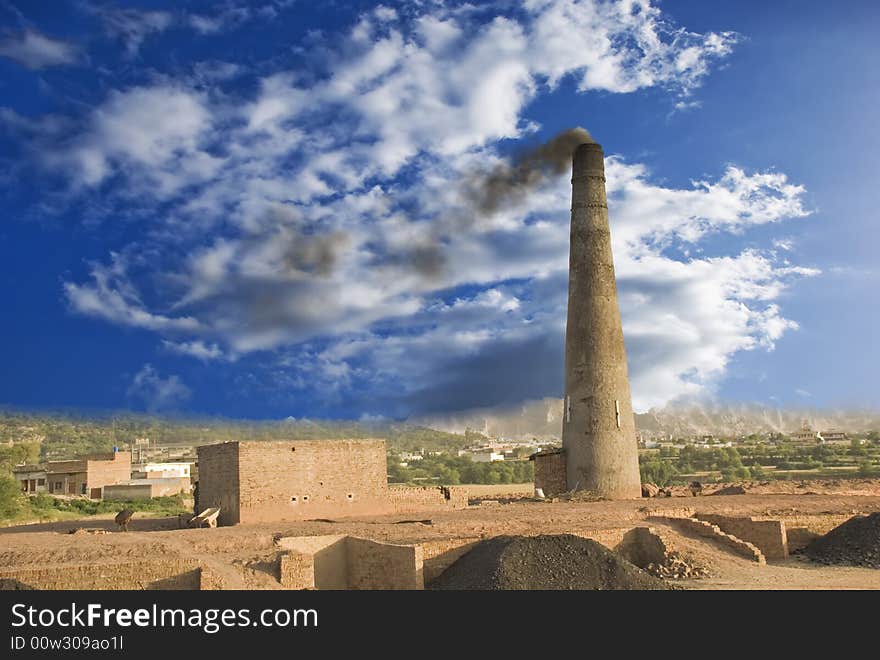 Brick baking tower emitting carbon smoke. Brick baking tower emitting carbon smoke