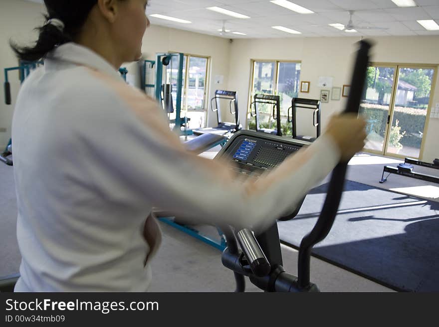 Young girl running on treadmill