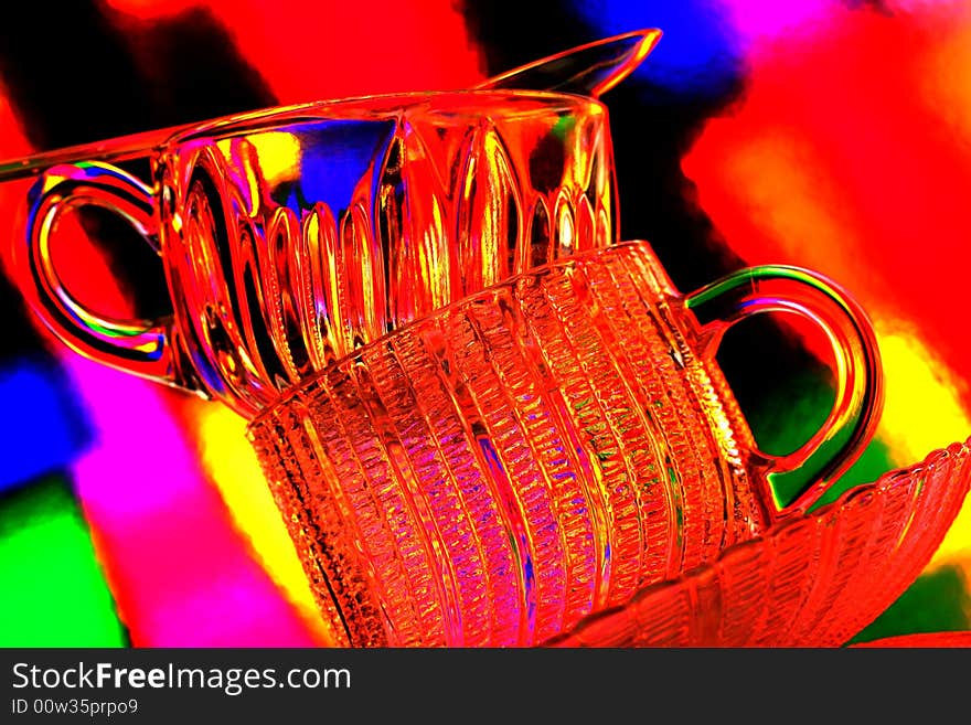 Glass of tea against multi colored abstract background. Glass of tea against multi colored abstract background.