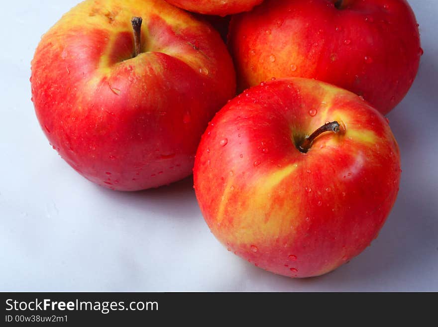 An orange and dome apples