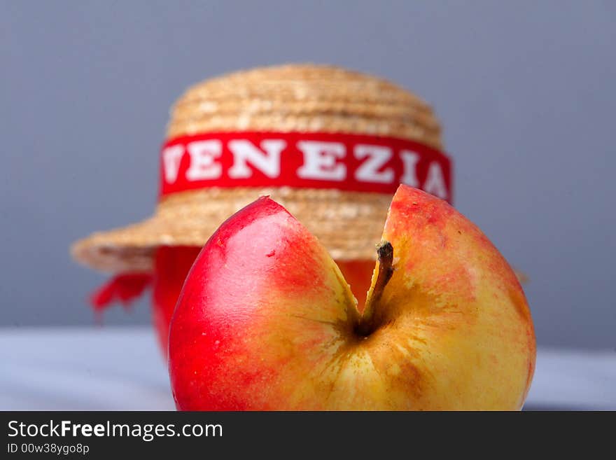 A hat and half of an apple