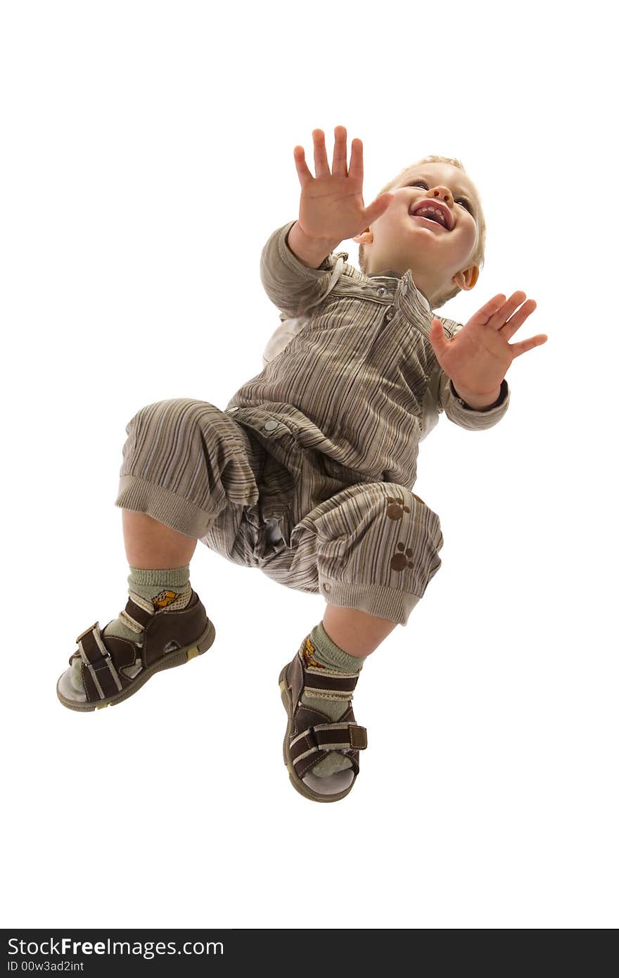 A little, blonde boy on all four. Isolated on white background. Unusual angle view - directly below. A little, blonde boy on all four. Isolated on white background. Unusual angle view - directly below.