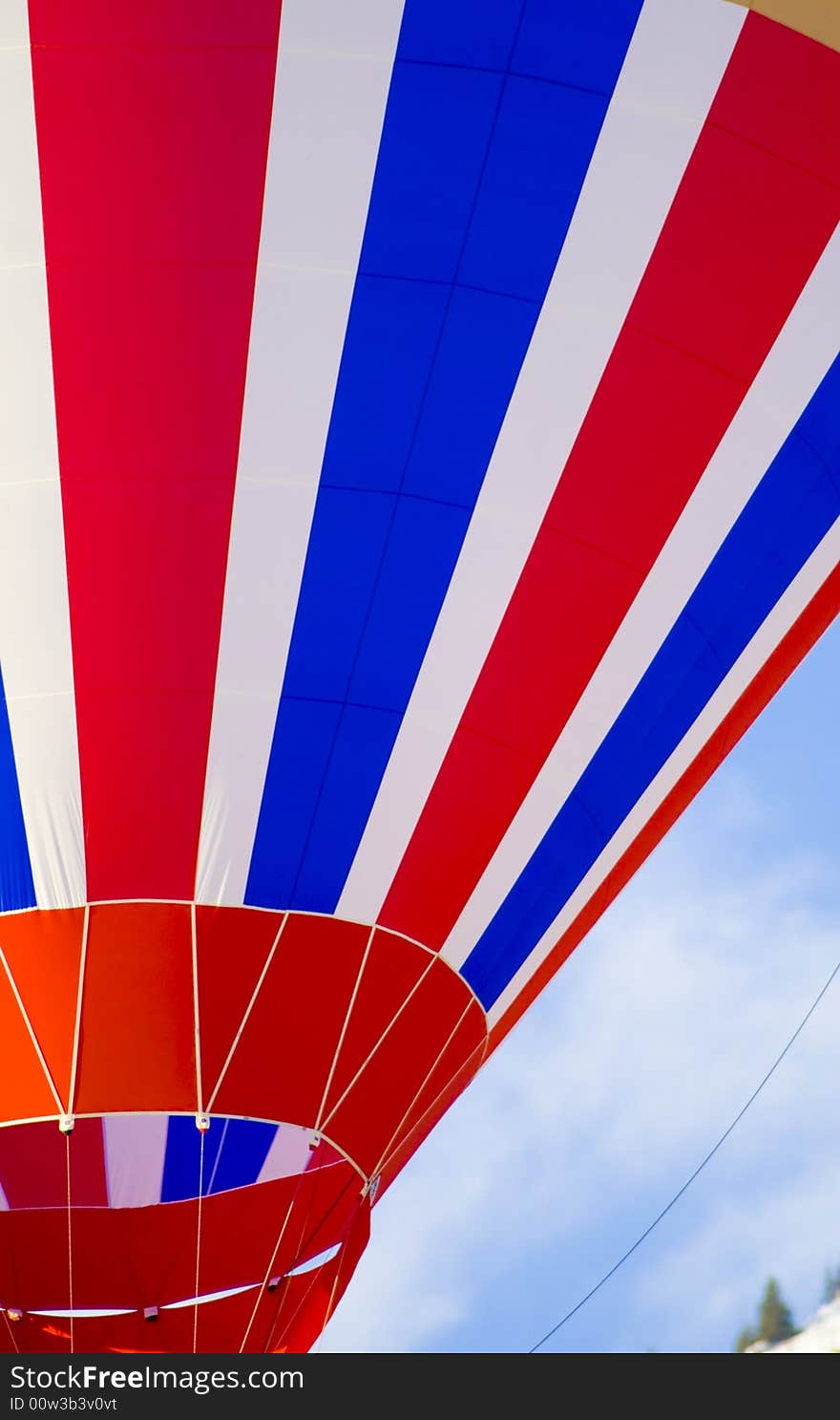 Colorful hot air balloon glides in the blue sky. Colorful hot air balloon glides in the blue sky