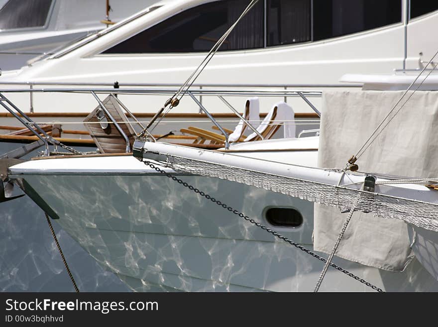 Boat reflections in nice harbour, france