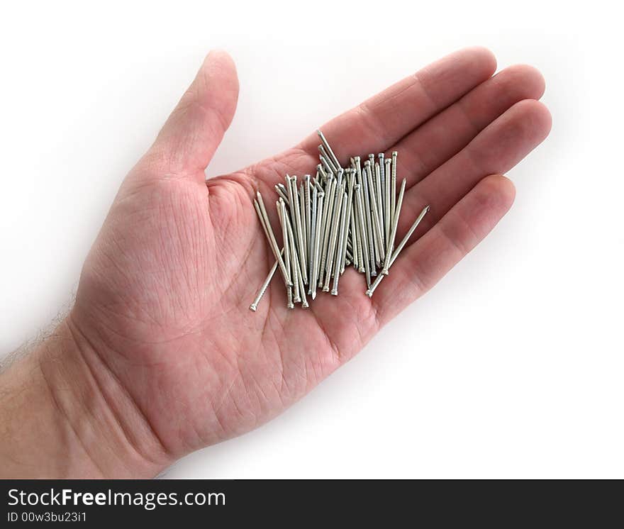 Hand with group of silver nails isolated on white. Hand with group of silver nails isolated on white