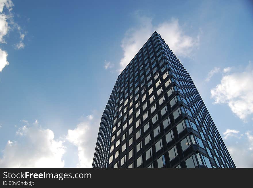 Bussiness building on cloudy sky background