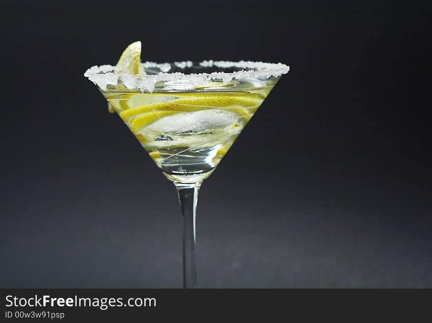 Martini with sugar crust, lemon and peels