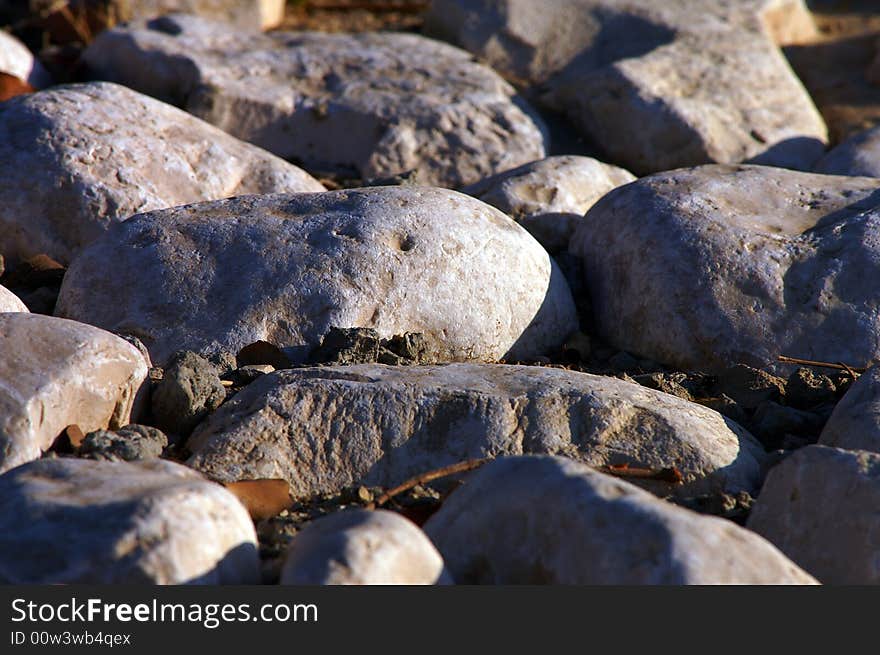 A close up of sidewalk made of rocks