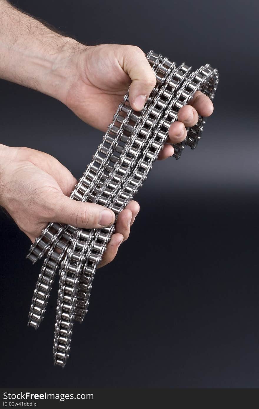 Hands with metal link chain