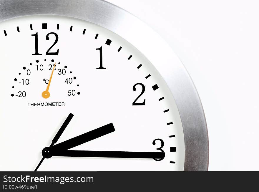 Close-up of a wall clock over white background