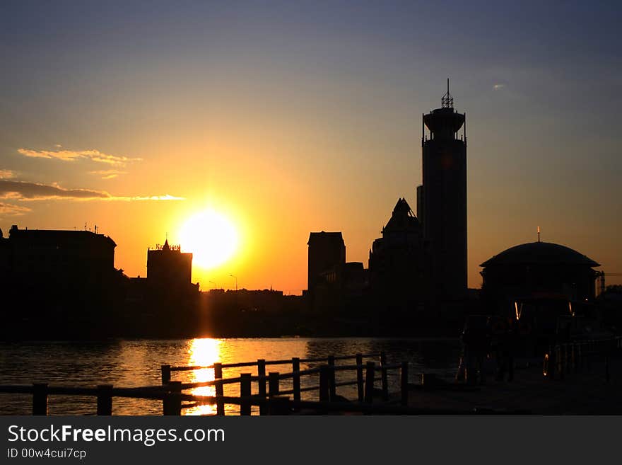 Sunset on the river with silhouettes