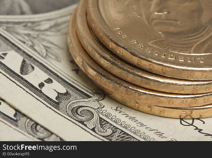 Abstract of the new U.S. Dollar coin on Dollar Bills with Narrow Depth of Field. Abstract of the new U.S. Dollar coin on Dollar Bills with Narrow Depth of Field.