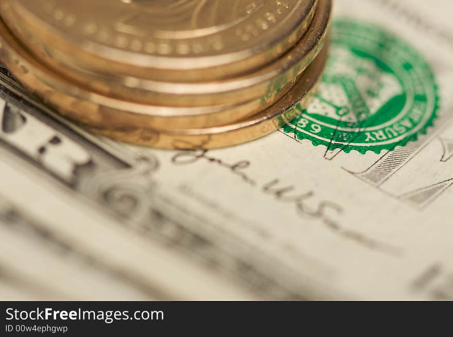 Extreme Close-up Abstract of the new U.S. Dollar coin on Dollar Bills with Narrow Depth of Field. Extreme Close-up Abstract of the new U.S. Dollar coin on Dollar Bills with Narrow Depth of Field.