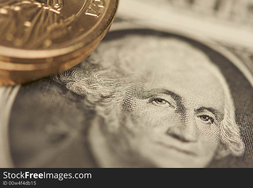 Extreme Close-up Abstract of the new U.S. Dollar coin on Dollar Bills with Narrow Depth of Field. Extreme Close-up Abstract of the new U.S. Dollar coin on Dollar Bills with Narrow Depth of Field.